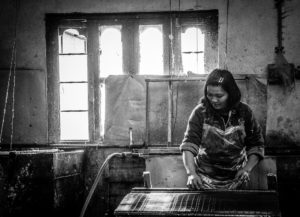 Woman working at the Jungshi Paper Factory in Thimphu, Bhutan