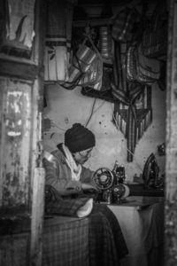 Man sewing in his shop in Thimphu, Bhutan