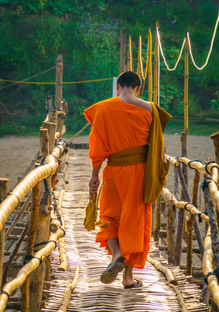 Monk crossing the bamboo bridge, Luang Prabang, Laos