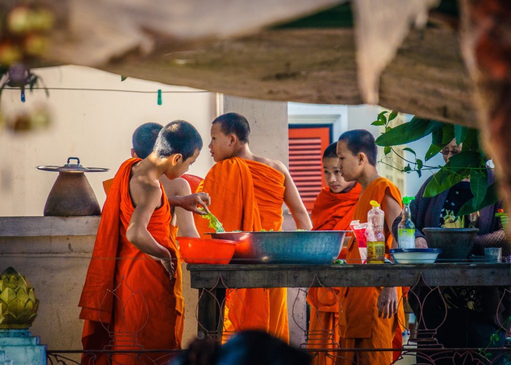 Young monks cooking Luang Prabang, Laos