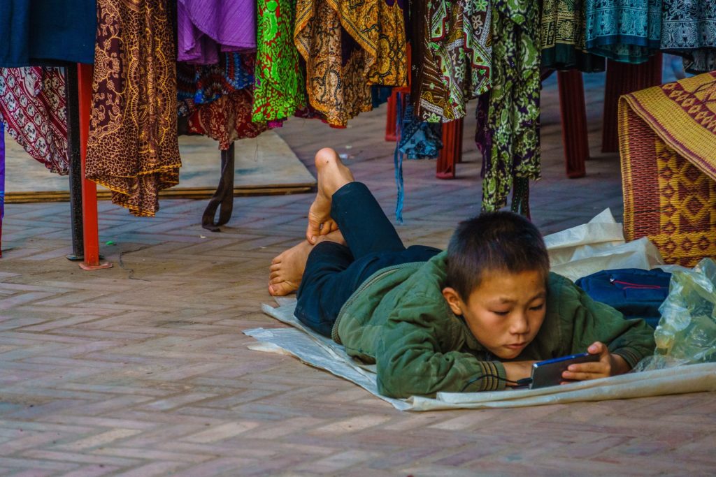 Little boy at night market in Luang Prabang, Laos